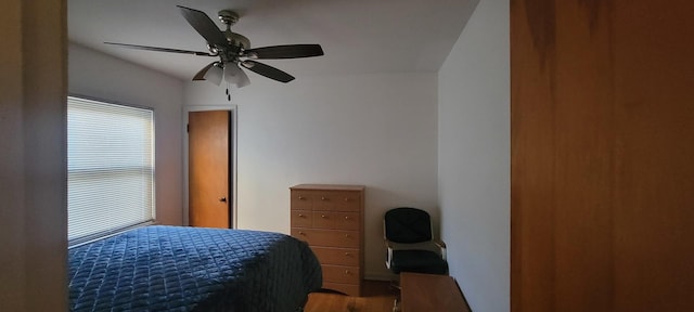 bedroom with ceiling fan and hardwood / wood-style flooring