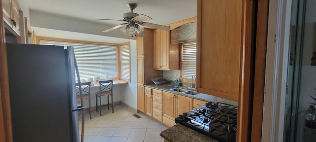 kitchen with ceiling fan, sink, light tile patterned floors, and black appliances