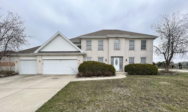 view of front of property with a front yard and a garage