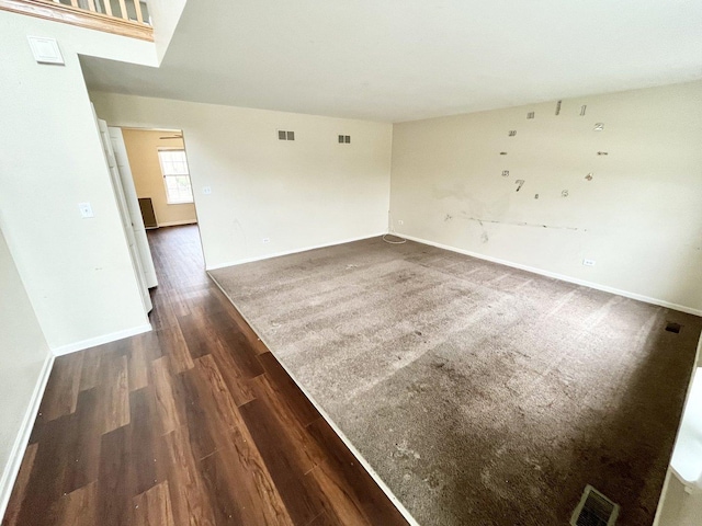 spare room with dark hardwood / wood-style flooring