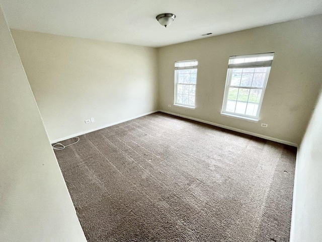 spare room featuring carpet