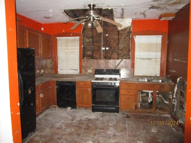 kitchen featuring sink, backsplash, ceiling fan, and black appliances