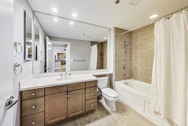 full bathroom featuring vanity, tile patterned flooring, shower / bath combination with curtain, and toilet