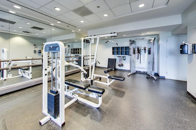 exercise room featuring a drop ceiling