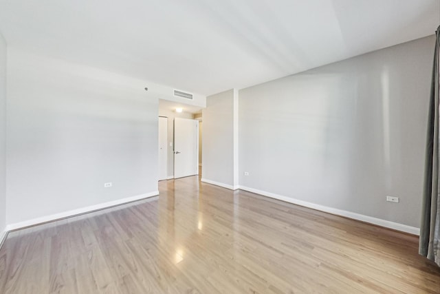 unfurnished room with light hardwood / wood-style flooring