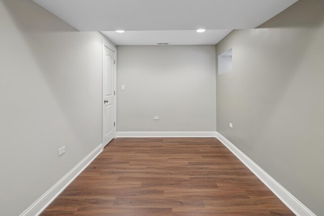 interior space with recessed lighting, dark wood-style floors, and baseboards