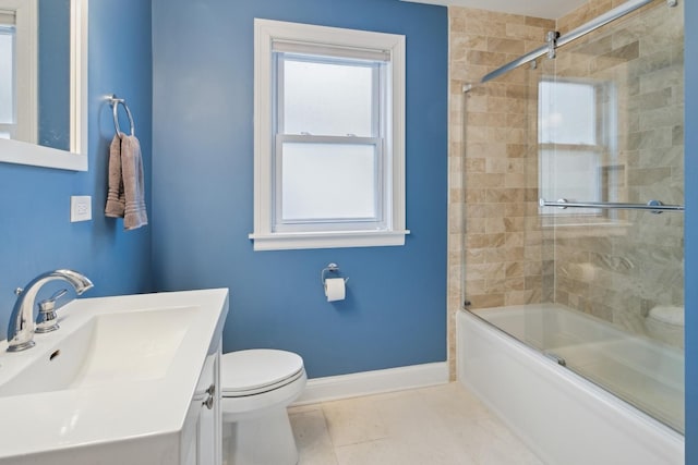 bathroom featuring tile patterned floors, toilet, baseboards, and shower / bath combination with glass door