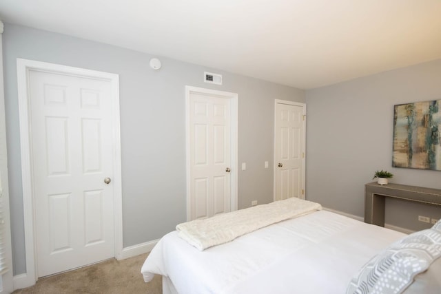 bedroom with light colored carpet