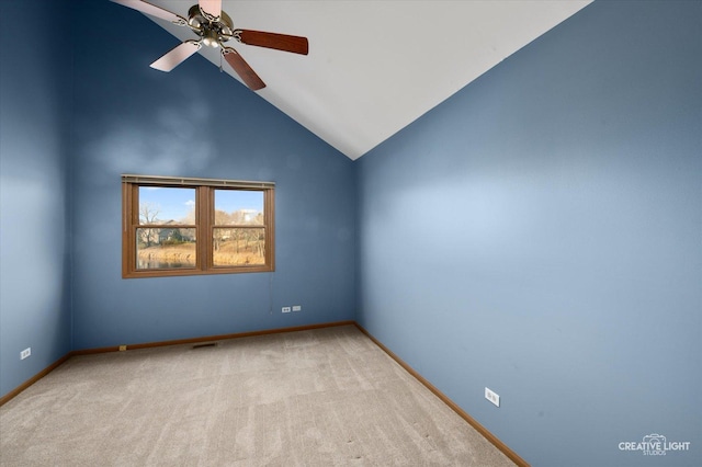 unfurnished room with ceiling fan, light carpet, and vaulted ceiling