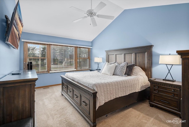 bedroom featuring ceiling fan, light colored carpet, and high vaulted ceiling