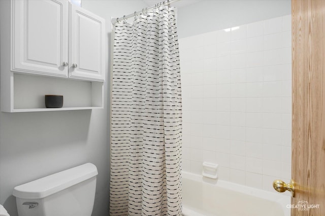 bathroom featuring shower / bathtub combination with curtain and toilet