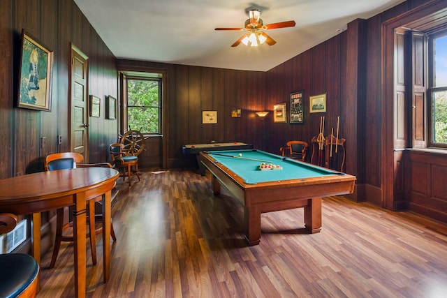 rec room featuring wood-type flooring, pool table, wooden walls, and ceiling fan