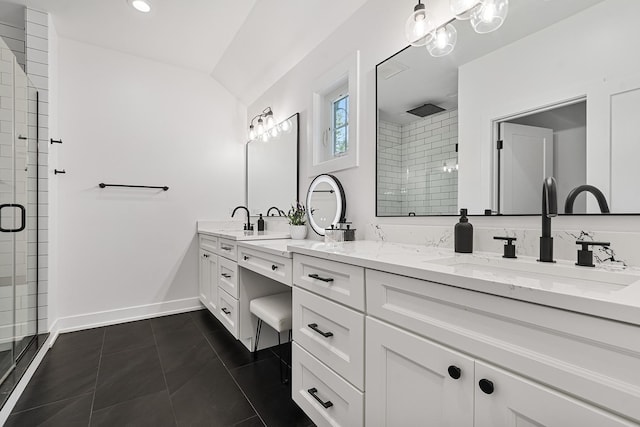 full bath featuring double vanity, baseboards, tile patterned flooring, a shower stall, and a sink