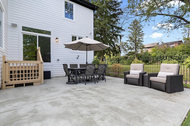 view of patio / terrace featuring outdoor dining space and fence