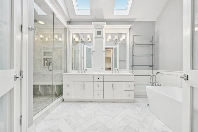 bathroom featuring separate shower and tub, lofted ceiling with skylight, and vanity