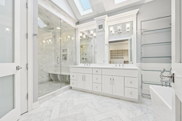 bathroom with vanity, lofted ceiling with skylight, and shower with separate bathtub