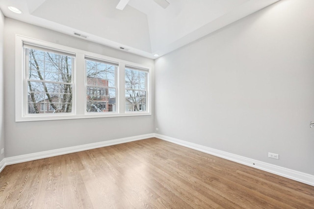 spare room with wood-type flooring