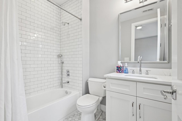 full bathroom featuring shower / tub combo, vanity, and toilet