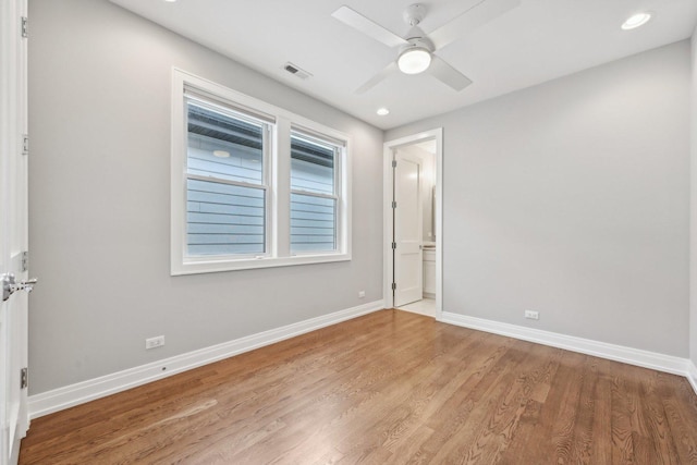 empty room featuring light hardwood / wood-style flooring and ceiling fan