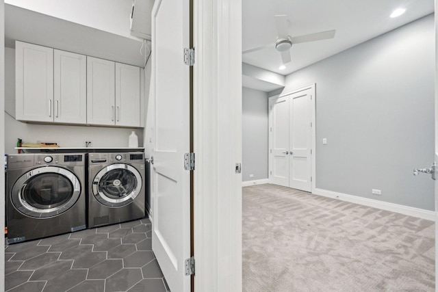 laundry room featuring dark colored carpet, ceiling fan, cabinets, and independent washer and dryer