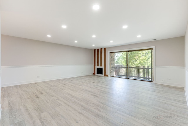 empty room with light wood-type flooring