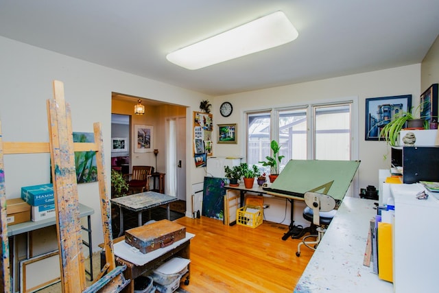 home office with wood-type flooring