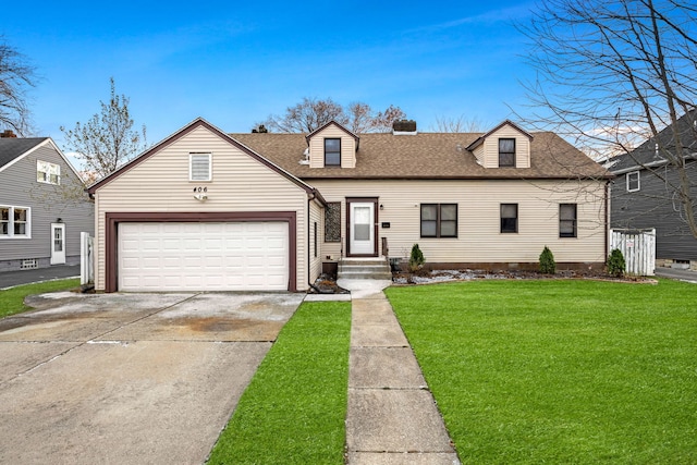 view of front of property with a front lawn and a garage