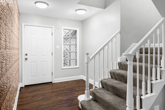 foyer with dark hardwood / wood-style flooring