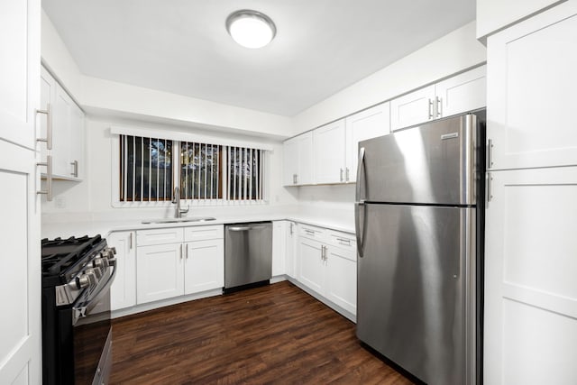 kitchen featuring white cabinets, dark hardwood / wood-style flooring, stainless steel appliances, and sink