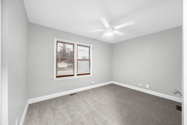 spare room with carpet flooring and ceiling fan