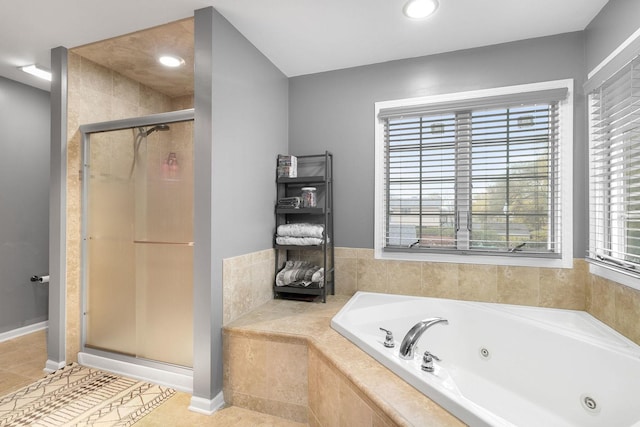 bathroom featuring tile patterned flooring and shower with separate bathtub