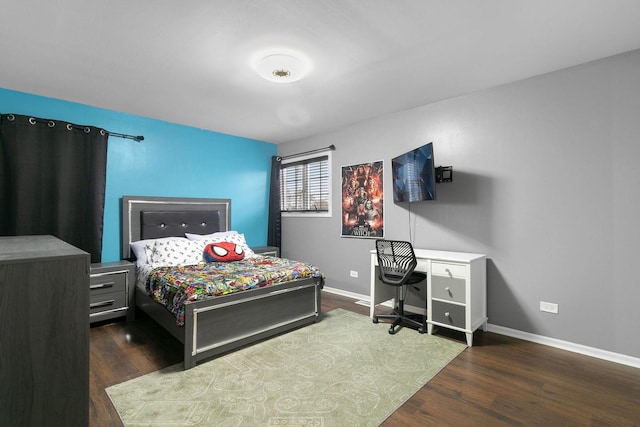 bedroom featuring dark hardwood / wood-style flooring