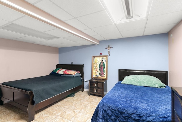 tiled bedroom with a drop ceiling