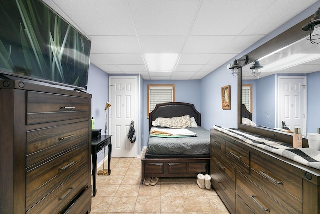 bedroom with a paneled ceiling