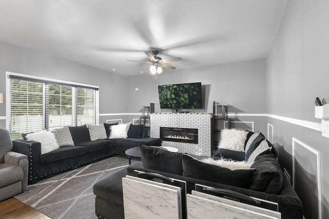 living room featuring hardwood / wood-style flooring and ceiling fan