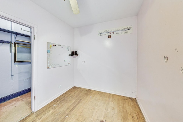 unfurnished room with wood-type flooring