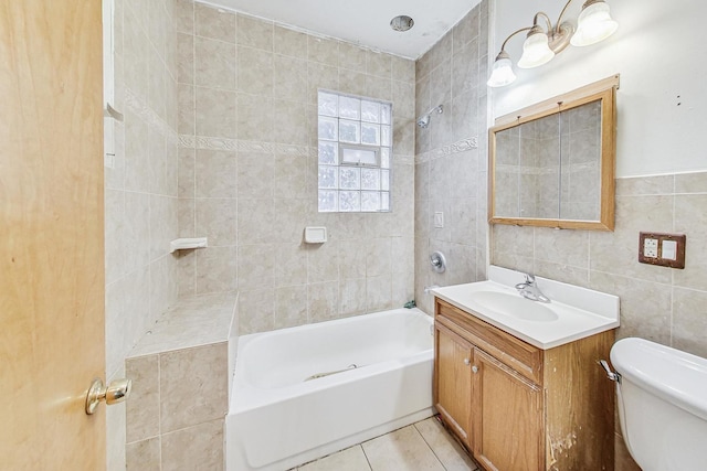 full bathroom featuring vanity, tile walls, tile patterned flooring, toilet, and tiled shower / bath