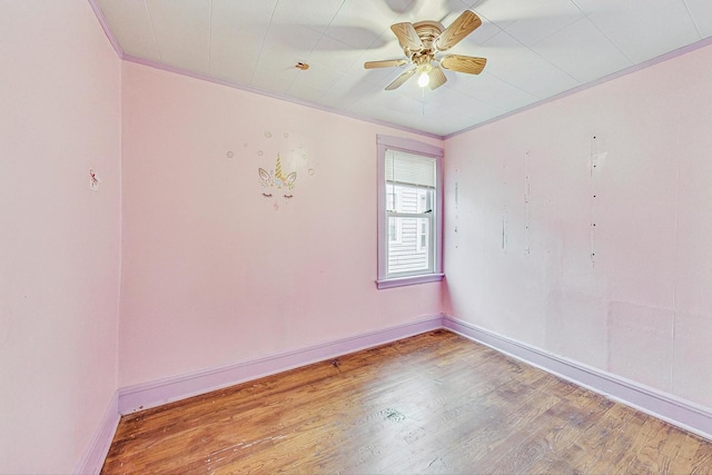 unfurnished room with hardwood / wood-style flooring, ceiling fan, and ornamental molding