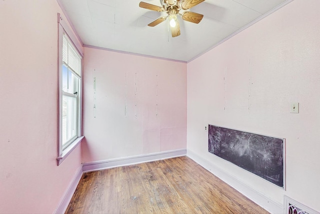 unfurnished room with hardwood / wood-style floors, ceiling fan, and ornamental molding