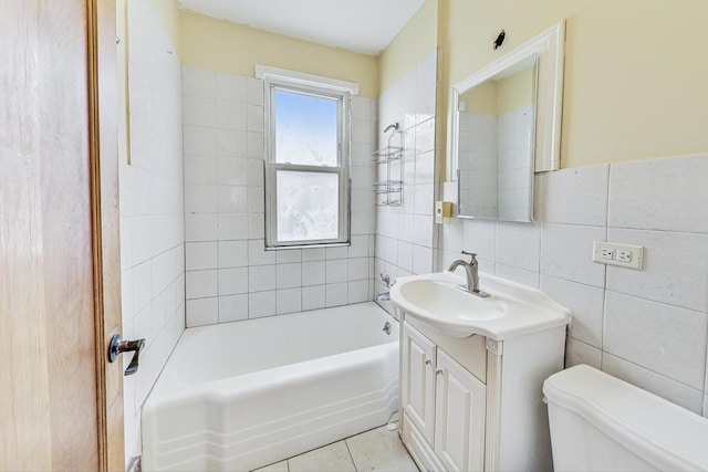 full bathroom featuring tile patterned flooring, vanity, toilet, and tile walls