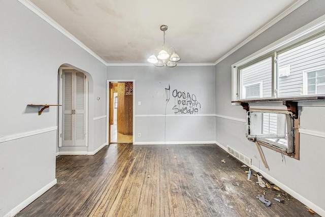 unfurnished dining area with a chandelier, dark hardwood / wood-style flooring, and ornamental molding