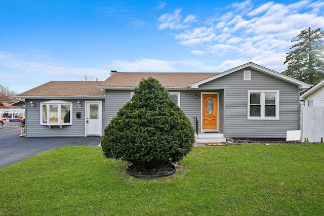 ranch-style house with a front lawn