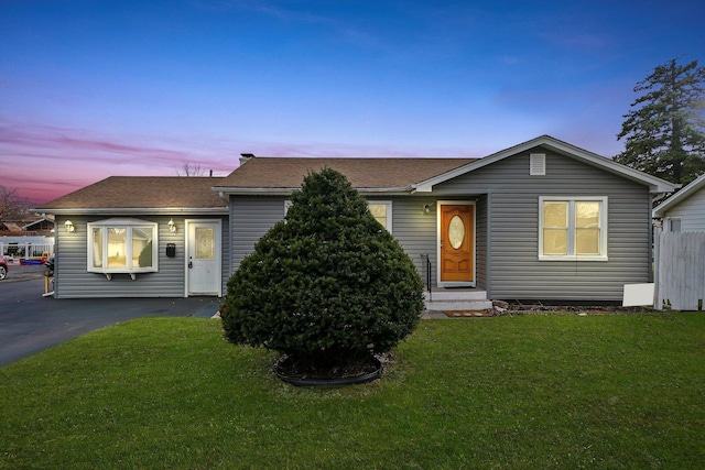 view of front of home featuring a lawn