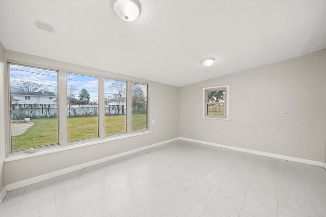 unfurnished room featuring vaulted ceiling