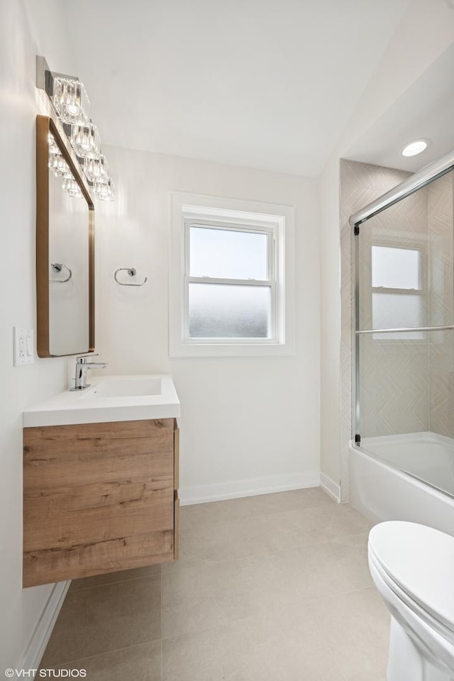 full bath with enclosed tub / shower combo, baseboards, vanity, and toilet