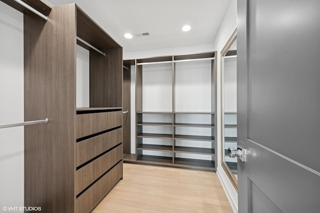 walk in closet with visible vents and light wood-style flooring