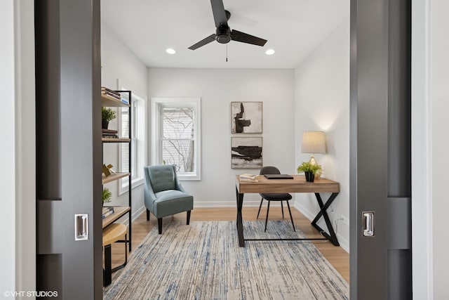 office area featuring ceiling fan, baseboards, wood finished floors, and recessed lighting