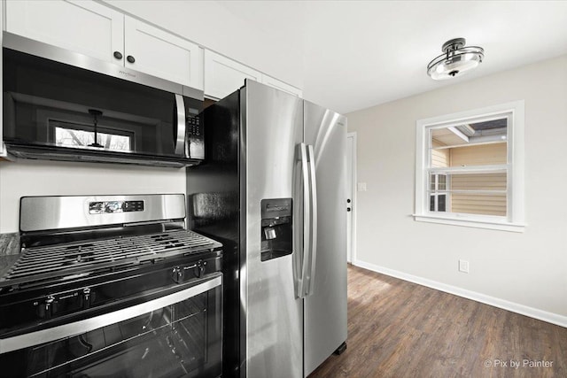 kitchen featuring dark hardwood / wood-style floors, white cabinetry, and appliances with stainless steel finishes