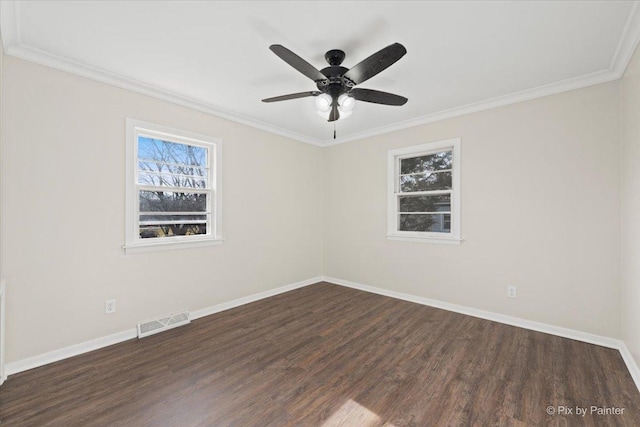 empty room featuring dark hardwood / wood-style flooring, ceiling fan, and ornamental molding