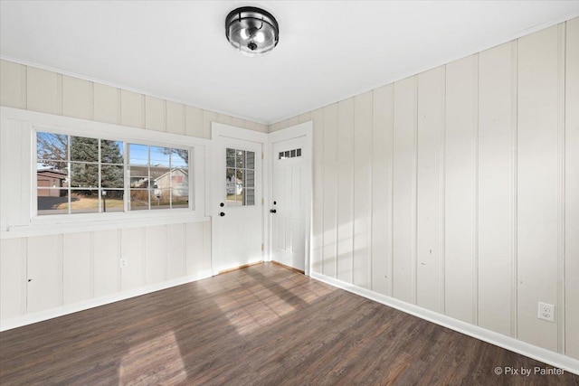 unfurnished room featuring dark wood-type flooring